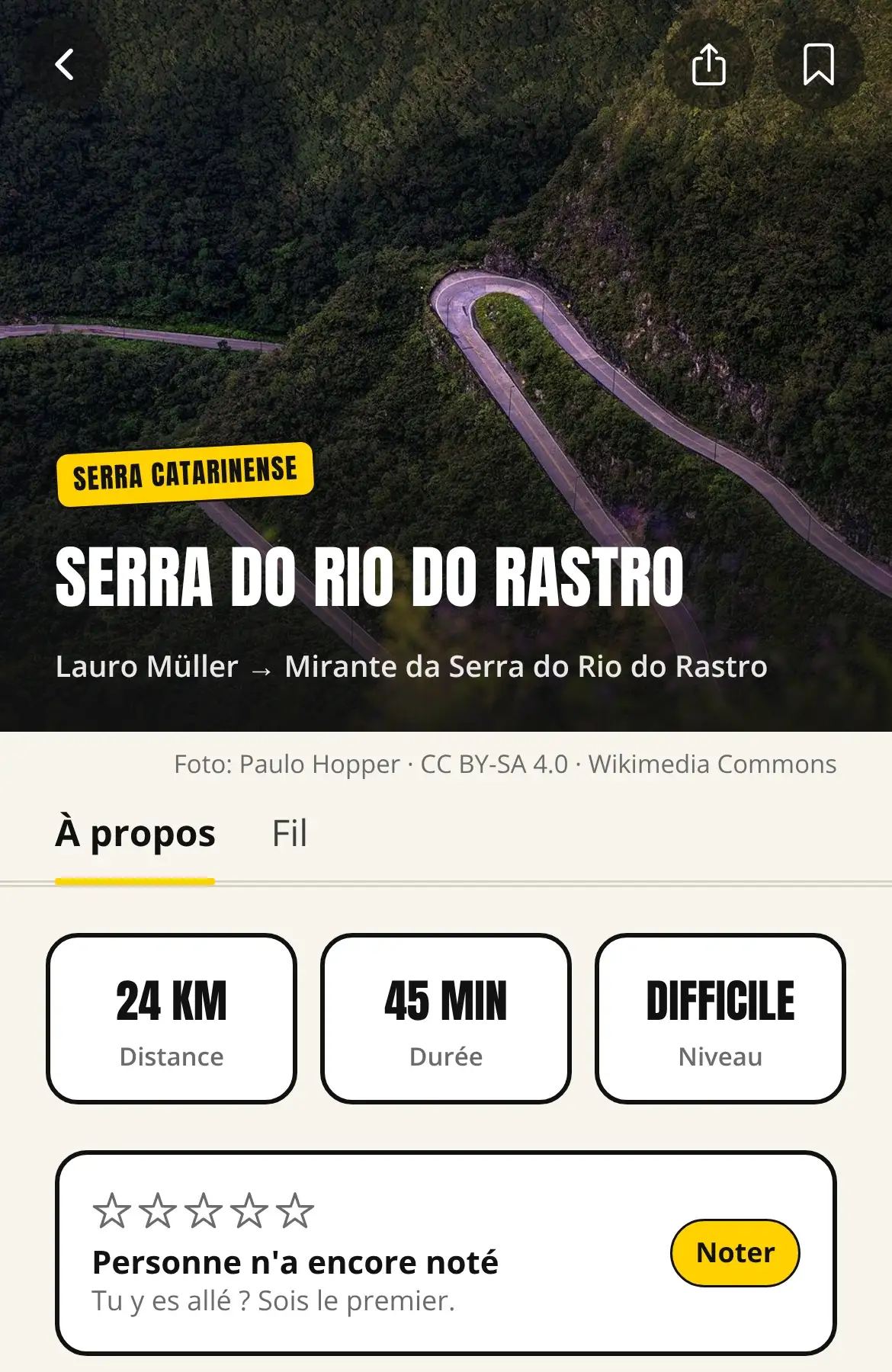Écran de l’itinéraire Serra do Rio do Rastro dans l’appli : photo de la route, 24 km, 45 minutes, niveau difficile.